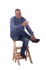 Sitting and holding a cup