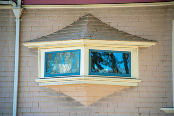 Secret window on hidden side of the house with rain gutter and panoramic view with mini roof and...