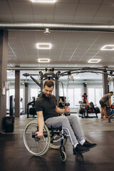 Hardworking invalid exercising with weights in the gym