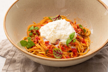Portion of gourmet spaghetti pasta arrabbiata with roast beef