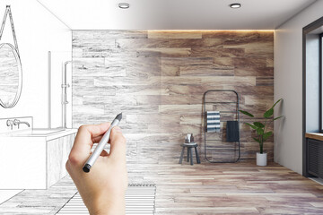 Human hand with pencil making design project of modern bathroom with stylish shower area, towel...
