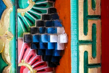 Closeup of traditional Tibetan ornament on the walls of Five Pagoda Temple in Hohhot, China