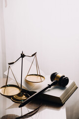 Justice and law concept.Male judge in a courtroom with the gavel, working with, computer and...