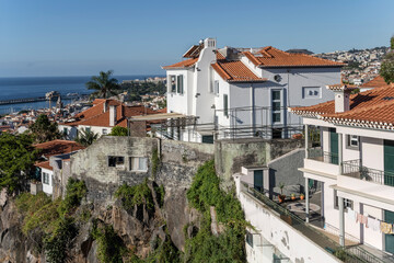 Fototapeta na wymiar aerial cityscape of historical town with houses on steep cliff, Funchal, Madeira