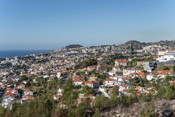 Fototapeta na wymiar aerial cityscape of historical hilly town on Atlantic ocean, Funchal, Madeira