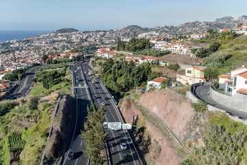 aerial with highway on slopes of  historical town on Atlantic ocean, Funchal, Madeira