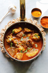 Mutton Rogan josh or mutton masala is India's famous Spicy nonvegetarian dish. It's made out of Goat meat and spices, garnished with fresh coriander. Lamb curry. copy space.