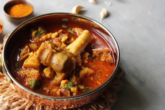 Mutton Rogan josh or mutton masala is India's famous Spicy nonvegetarian dish. It's made out of Goat meat and spices, garnished with fresh coriander. Lamb curry. copy space.