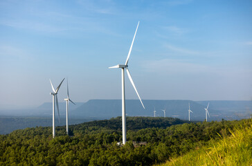 Windmill farm Generating electricity clean energy. Wind turbine farm generator by alternative green energy.