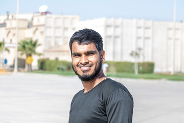 Indian man smiling in park 