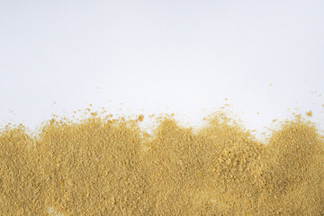 Unenriched dry food yeast on a white background