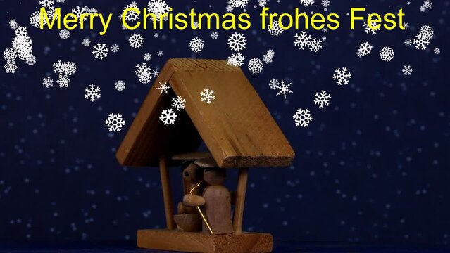 

nativity scene, Christmas decoration with figures and falling snow on turn table