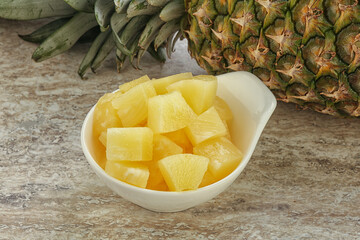 Marinated pineapple slices in the bowl