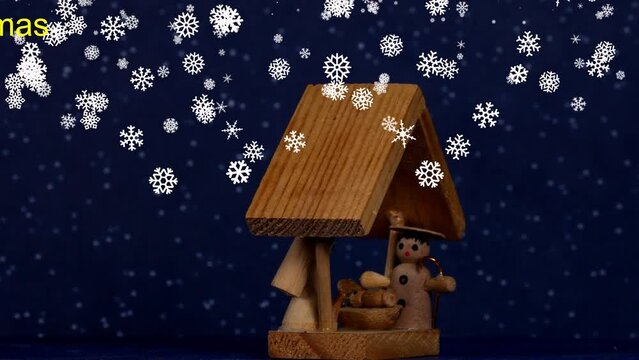 

nativity scene, Christmas decoration with figures and falling snow on turn table