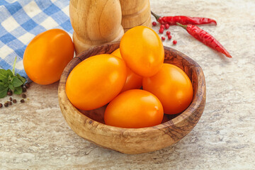 Sweet ripe yellow tomato in the bowl