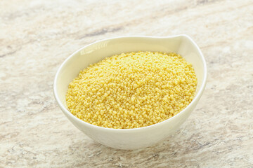 Raw couscous in the bowl