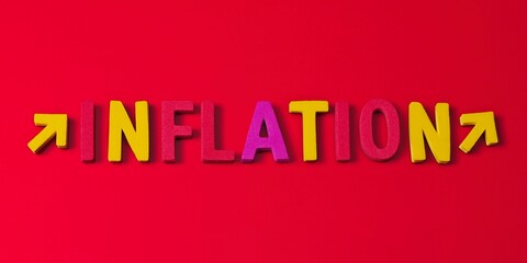 The word inflation built from magnetic letters  n red background . symbol for rising inflation.