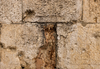 Bullet holes in the wall of the old city of Jerusalem. Zion Gate. Israel.