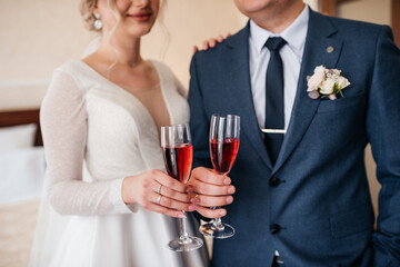 the bride and groom hold hands	
