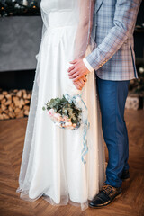 the bride and groom hold hands	
