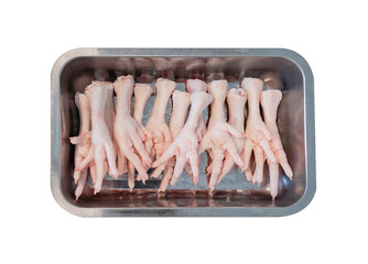 Raw chicken feet on stainless chopping board isolate.