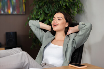 Close up shot attractive beautiful buisness woman at office home sitting in office chair relaxing after stressful hard day. Working process concept.