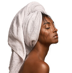 Shot of a beautiful young woman with her hair wrapped in a towel against an isolated transparent...