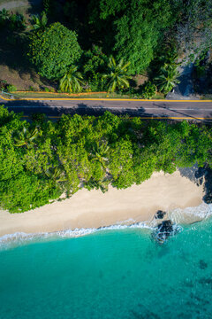 Drone Top Down of Road and beautiful beach on Praslin, Seychelles