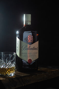 Bottle of Ballantine's Whiskey on dark background