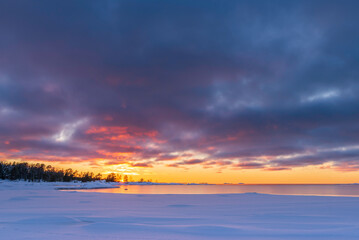 Sunset over the frozen sea. Fäboda, Finland