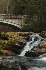 Fototapeta na wymiar waterfall in the forest, autumn mountain landscape 