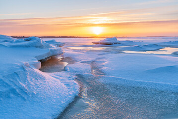 Sunset over the frozen sea. Pörkenäs, Finland