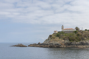 Fototapeta na wymiar Faro de Cudillero (Lighthouse de Cudillero), Cudillero village (AKA Pixueto), Asturias, Spain