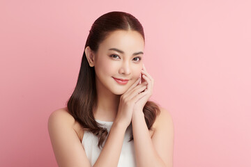 Beautiful young asian woman with clean fresh skin on pink background, Face care, Facial treatment, Cosmetology, beauty and spa, Asian women portrait.