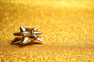 Close Up Of A Golden Christmas Gift Bow