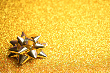 Close Up Of A Golden Gift Bow