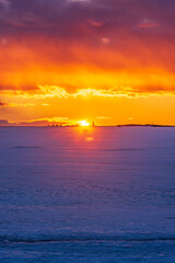 Dramatic winter sky at sunset. Pörkenäs, Finland