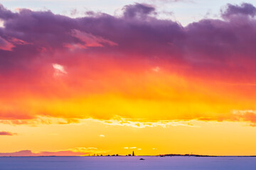Fototapeta na wymiar Dramatic winter sky at sunset. Pörkenäs, Finland