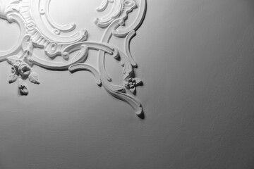 White bas-relief ceiling design details in rococo style,