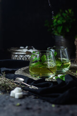 herbal, mint tea on a dark background