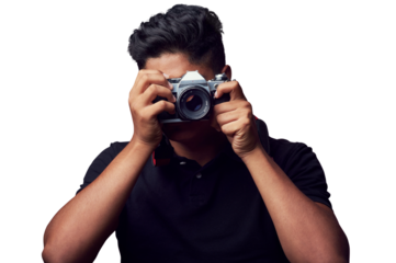 Studio shot of a young man holding up a camera againest isolated on a transparent png background