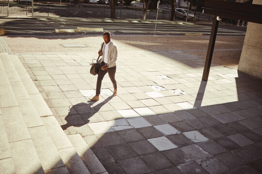 Style, Travel And A Fashion Young Man Walking In A Empty City Or Urban Town. Corporate African American Man Or Business Traveler Traveling In An Urban Town With Good Style And Trendy Going To A Hotel