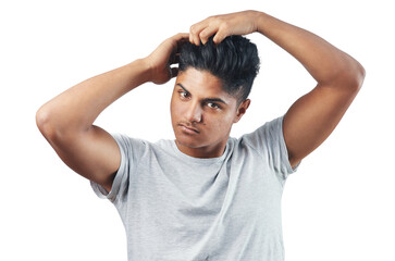 Studio shot of a young man putting his fingers through his hair against isolated on a transparent png background