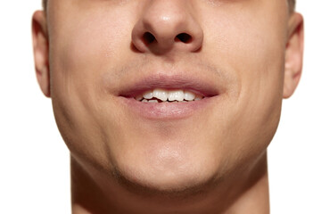 Cropped face of young man with well-kept skin isolated on white studio background. Concept of dental health, self-care, medicine and cosmetics.