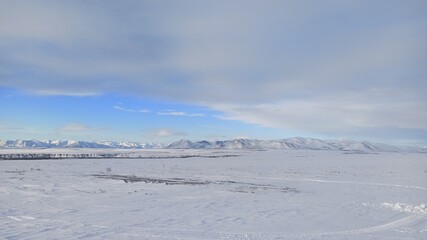Winter arctic landscape with mountains in the background
