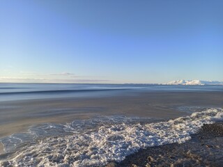 winter sea against the backdrop of mountains