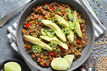 Lentil salad with avocado. Top view with copy space. Healthy food.