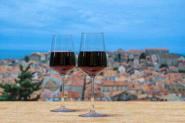 Two glasses of red wine with view of Dubrovnik city center