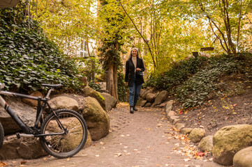 Woman walking in an autumn park