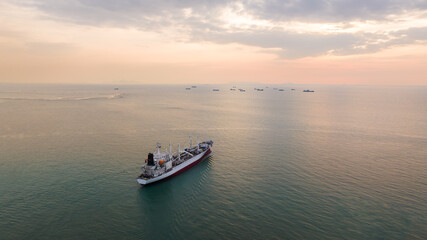ship sailing in sea at evening sky aerial view